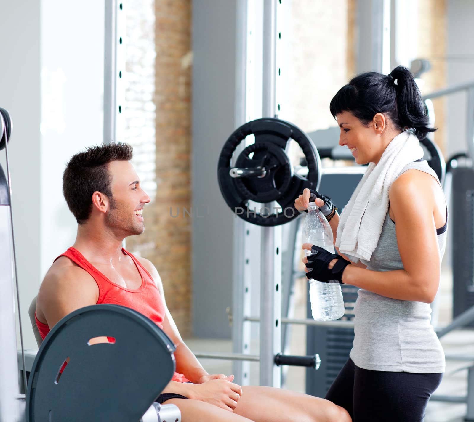 man and woman friends on sport gym relaxed by lunamarina