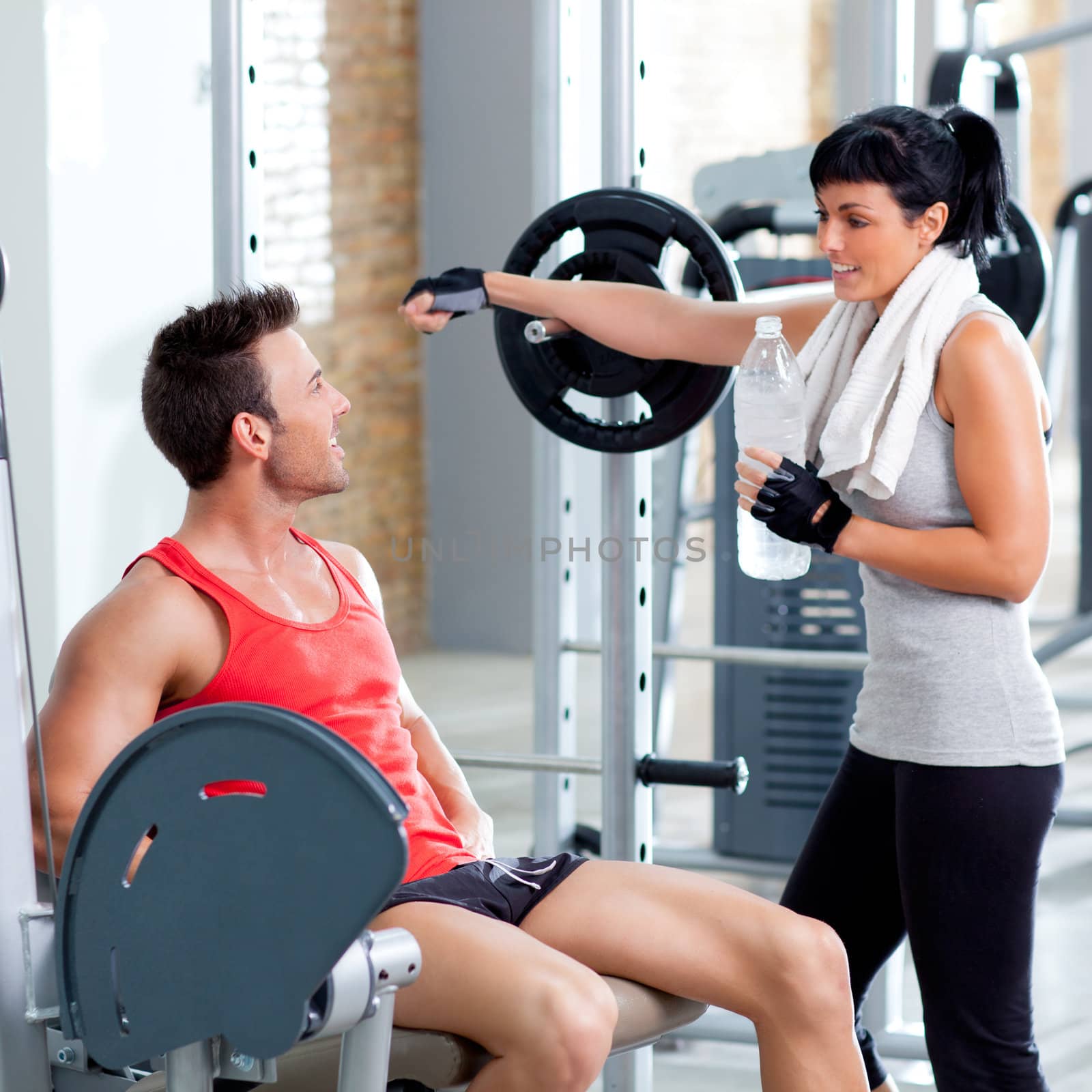 man and woman friends on sport gym relaxed by lunamarina