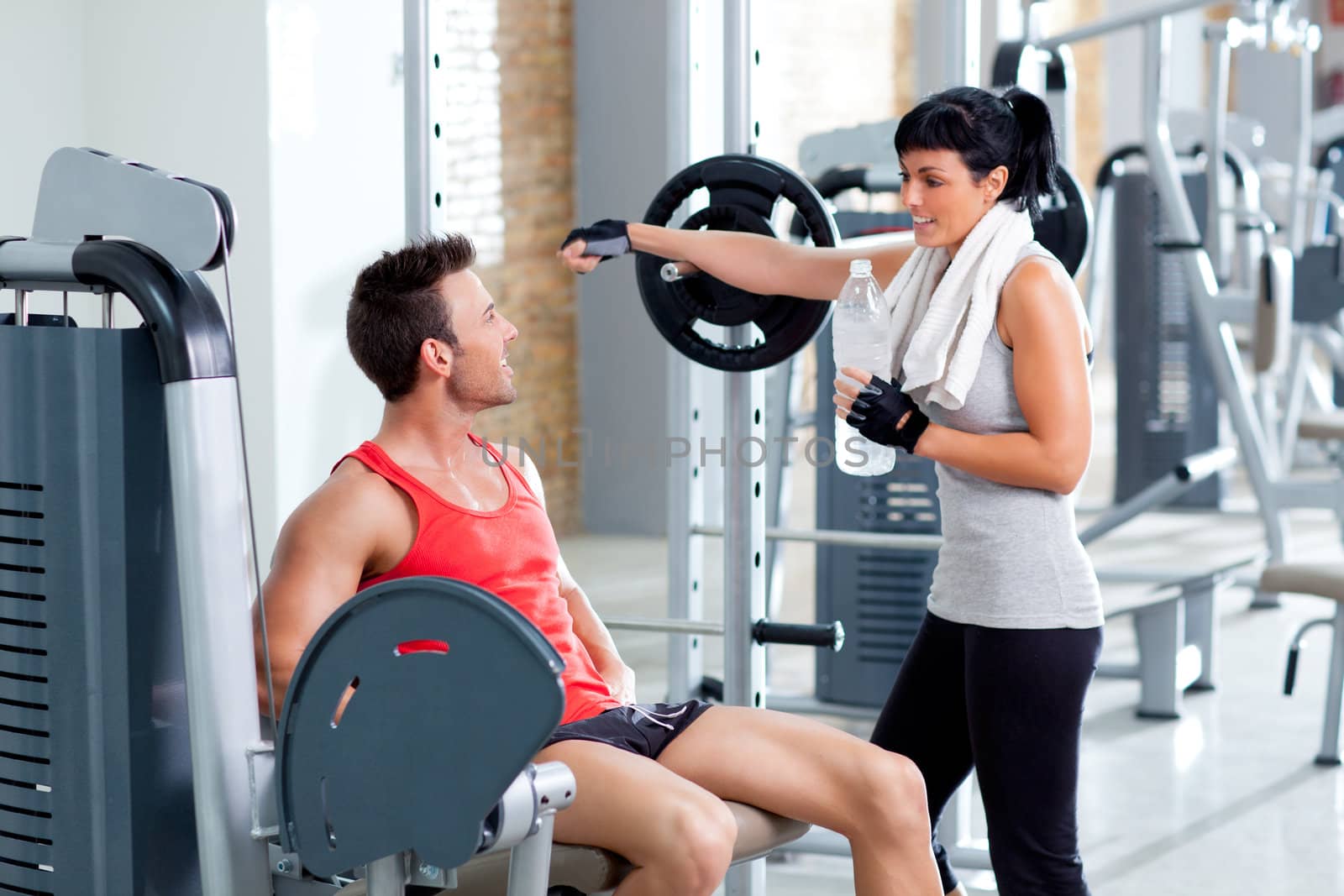 man and woman friends on sport gym relaxed by lunamarina