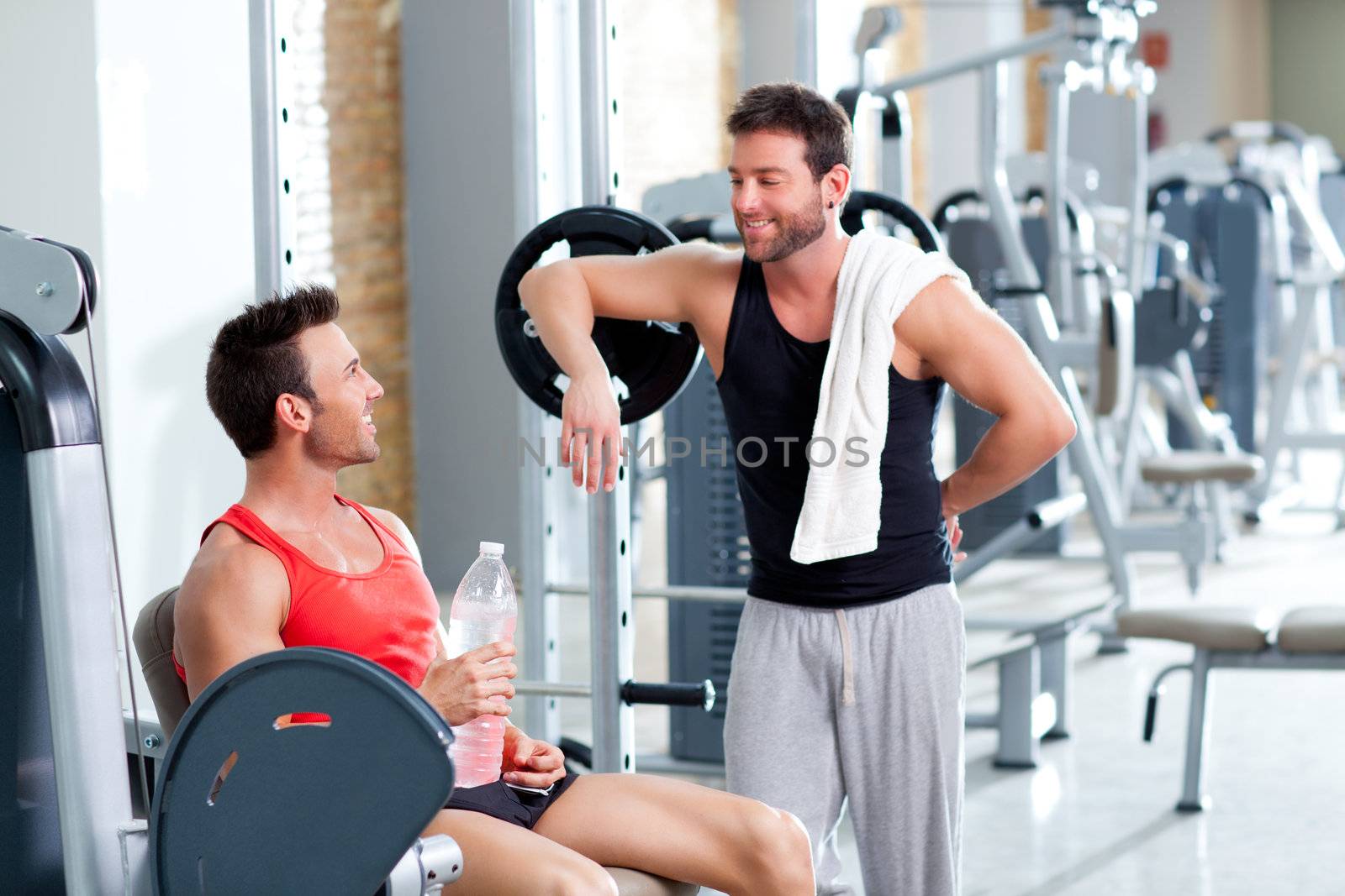 two men on a sport gym relaxed after fitness by lunamarina