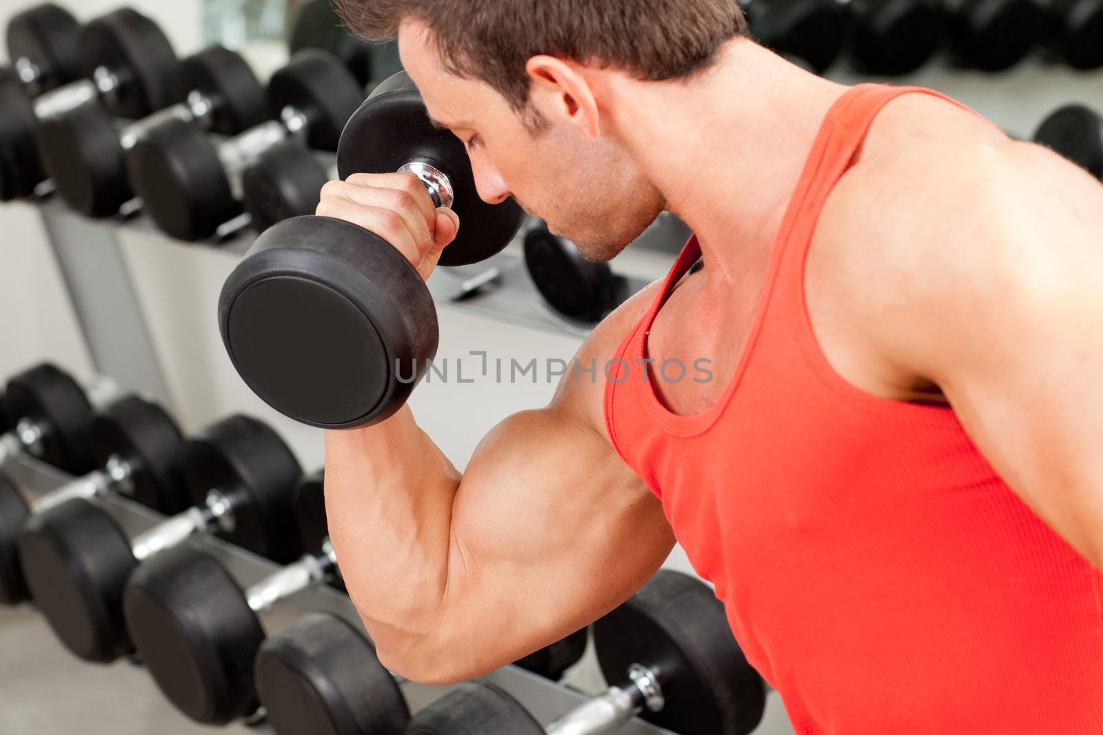 man with weight training equipment on sport gym club