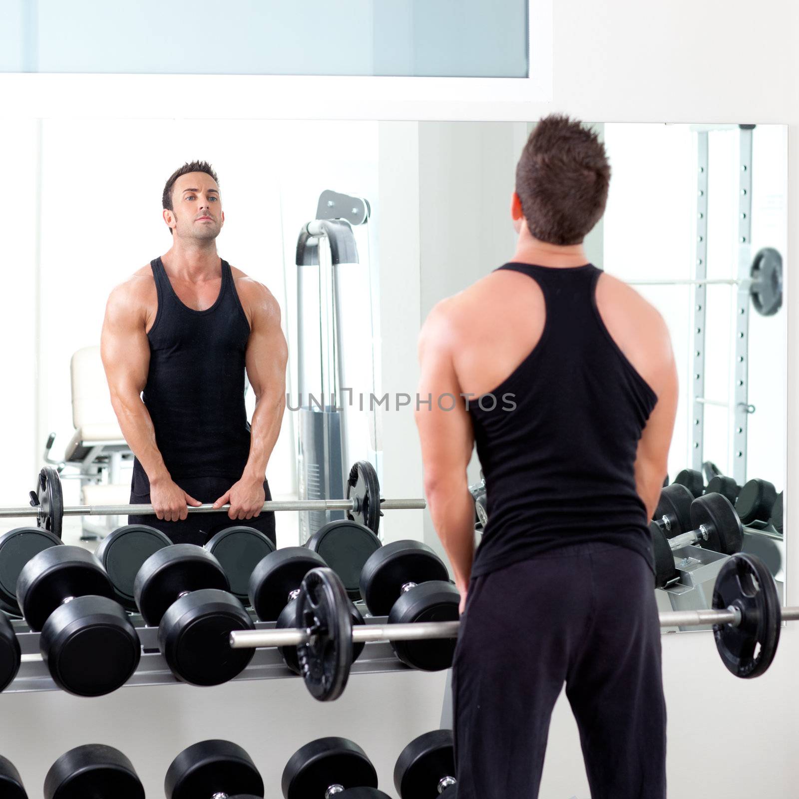 man with dumbbell weight training equipment on sport gym