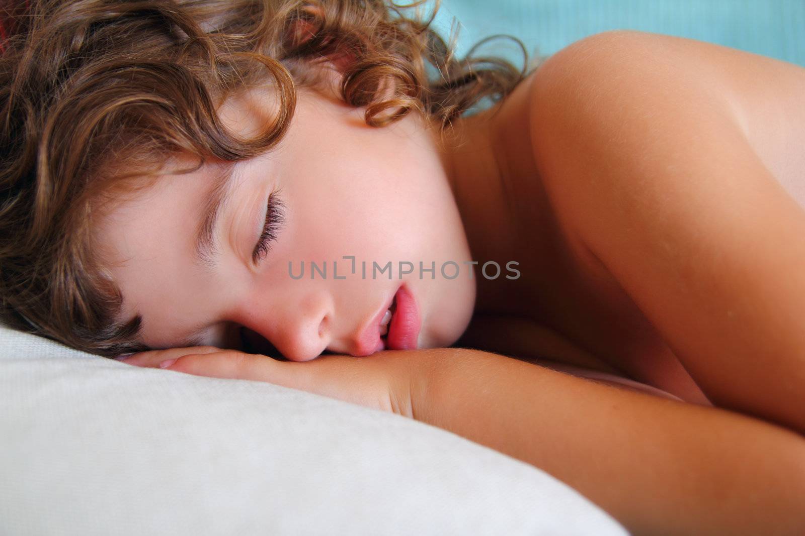 child girl sleeping happy on pillow in summer time