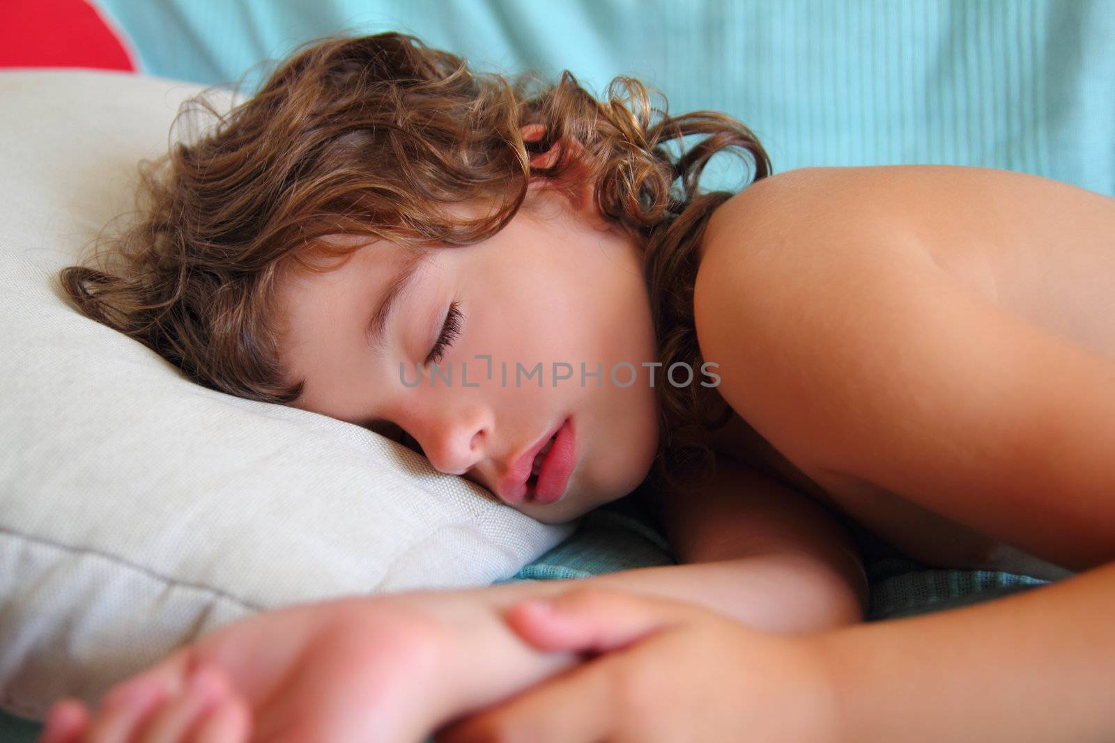 child girl sleeping happy on pillow in summer time