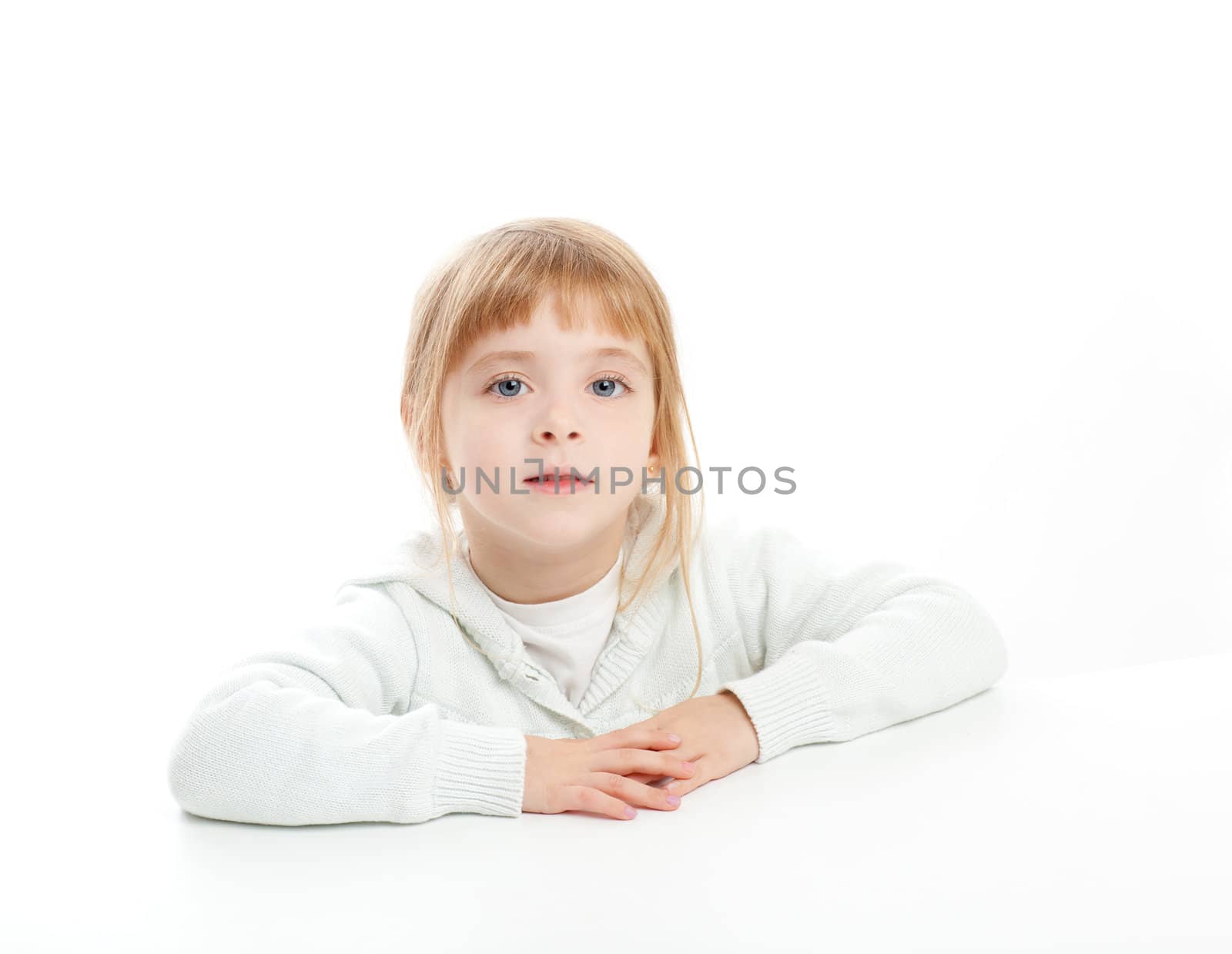 blond kid girl portrait on white desk table isolated studio background