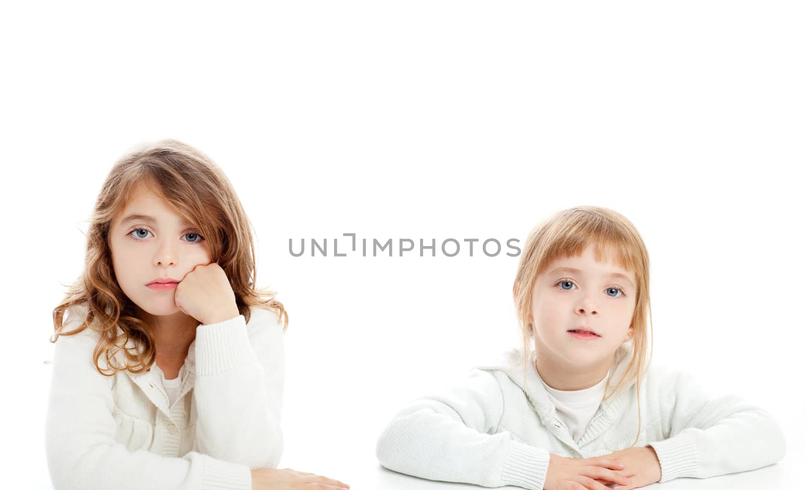 blond and brunette kid girls portrait on white by lunamarina