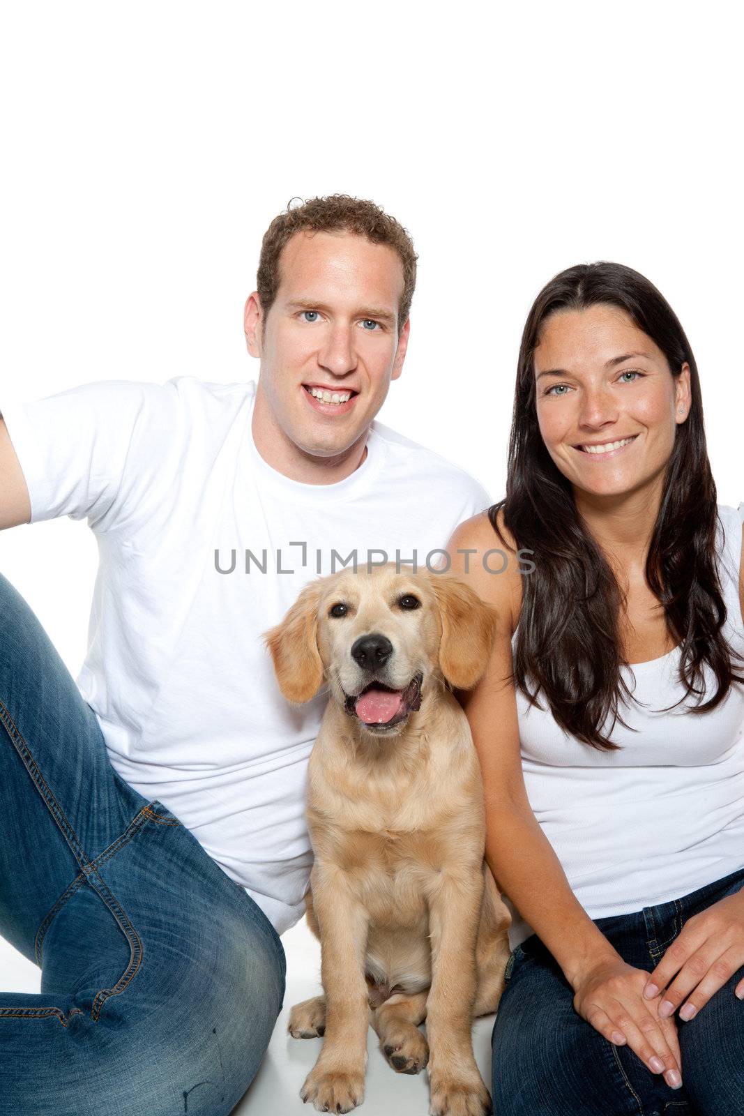 couple in love with puppy dog golden retriever isolated on white