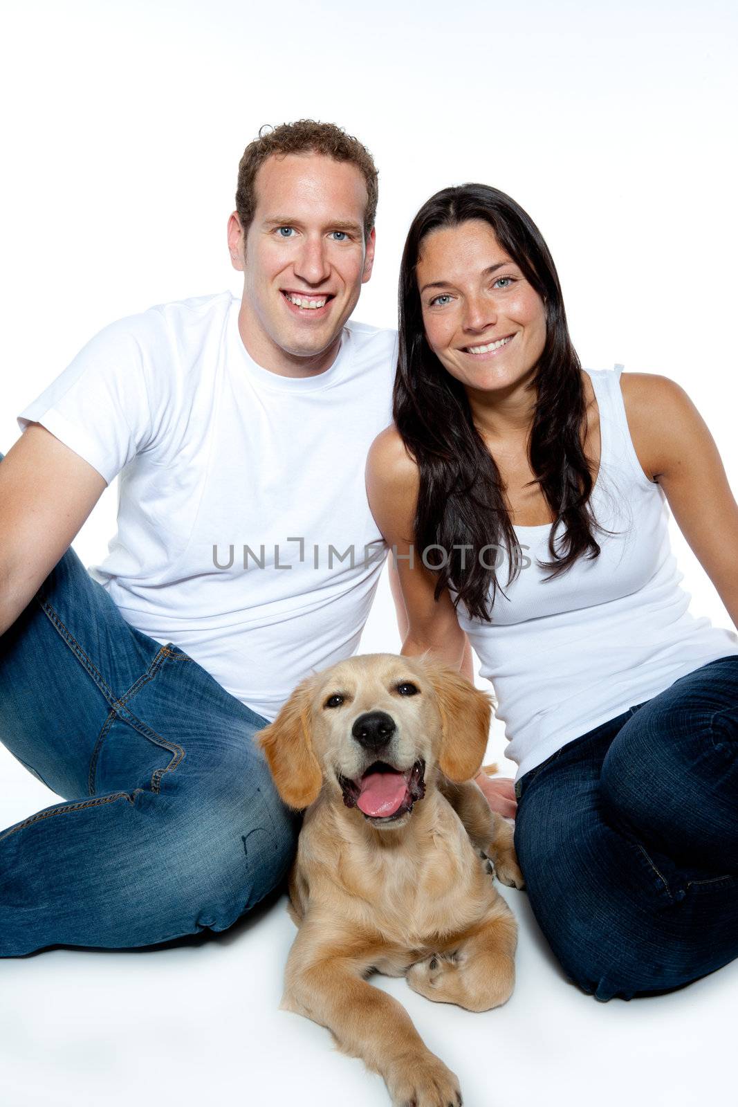 couple in love with puppy dog golden retriever isolated on white