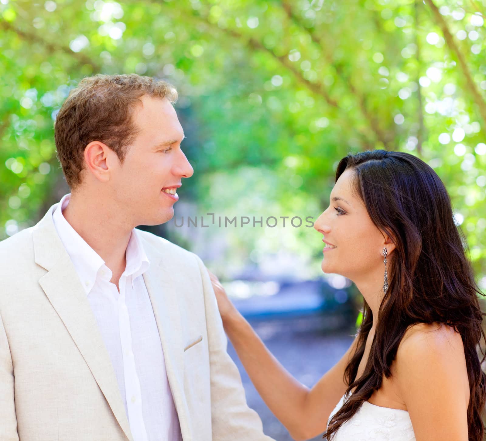 bride just married couple in love at outdoor green park