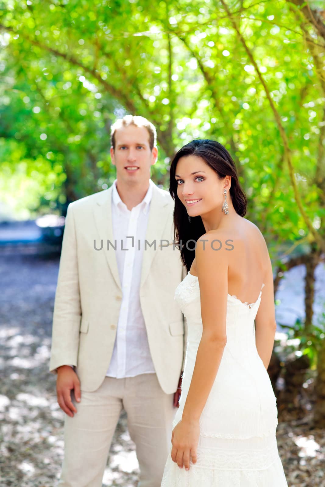 bride just married couple in love at outdoor green park