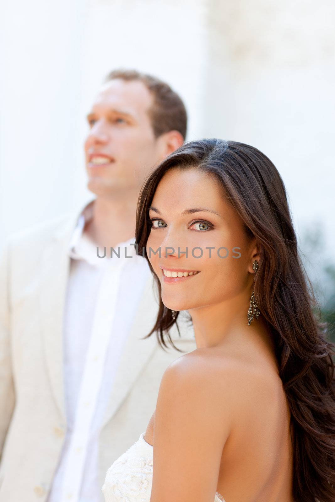 Happy beautiful woman portrait with man in blur background