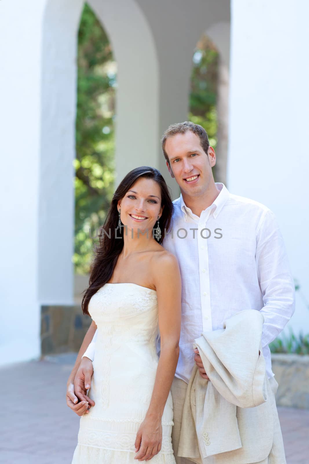 bride couple just married in mediterranean arches