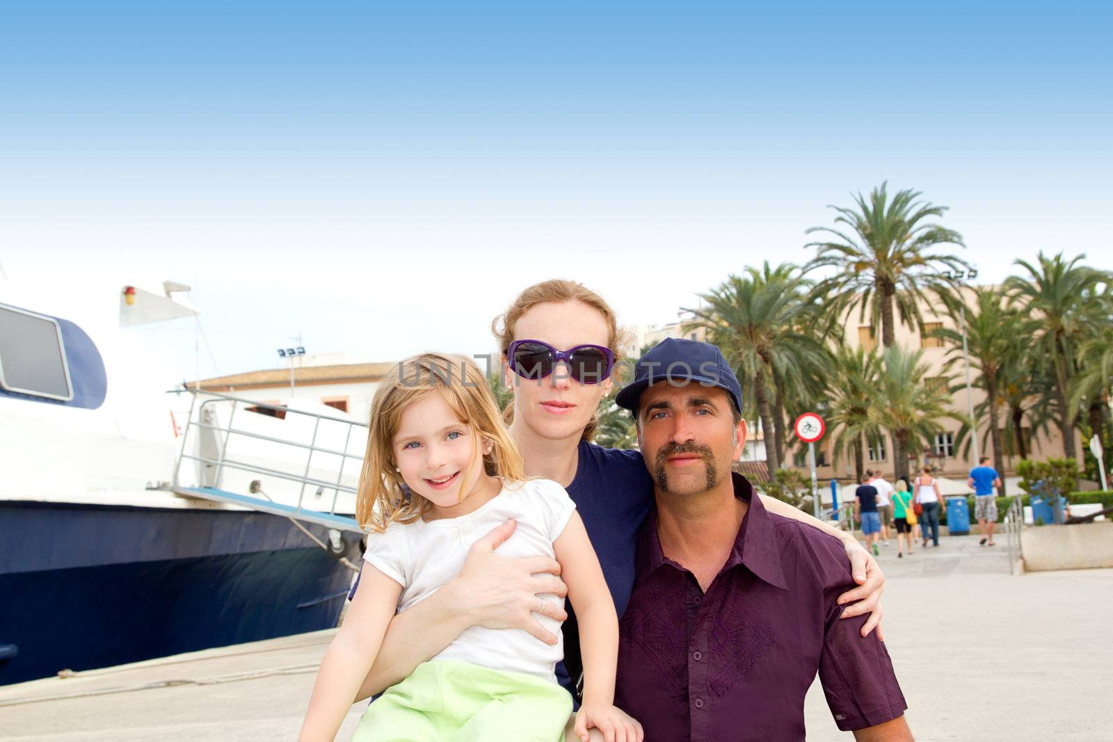 Family tourist in Ibiza town port in summer