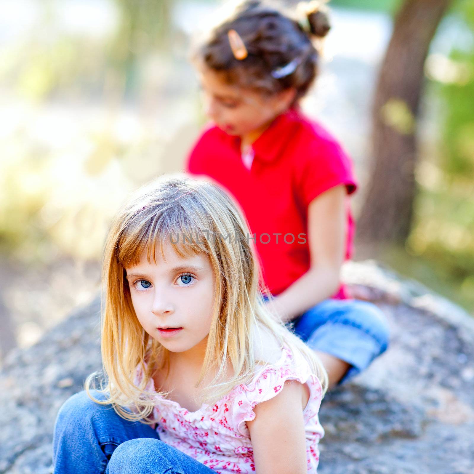 friends kid girls playing in forest rock outdoor