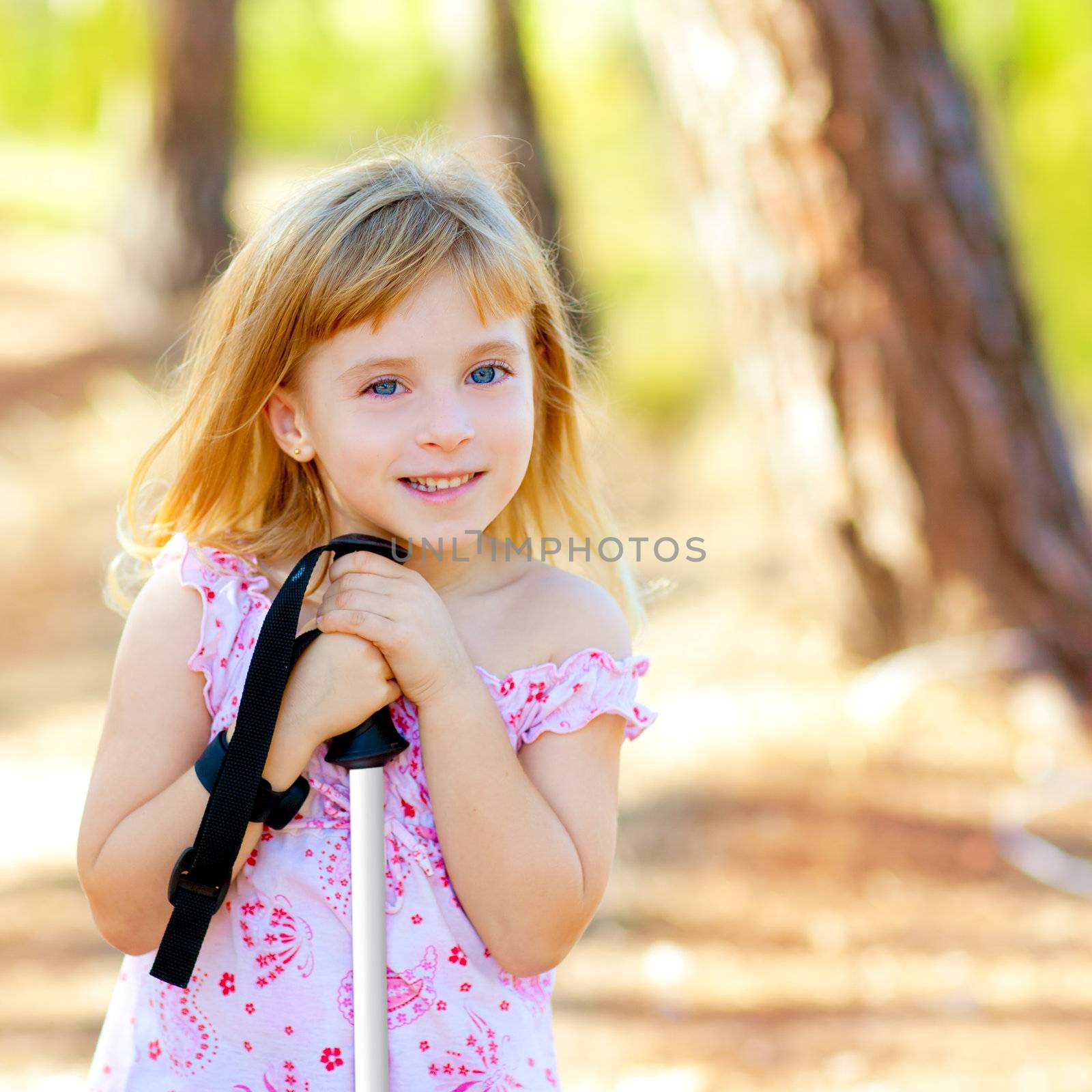 Beautiful kid girl in park forest smiling by lunamarina