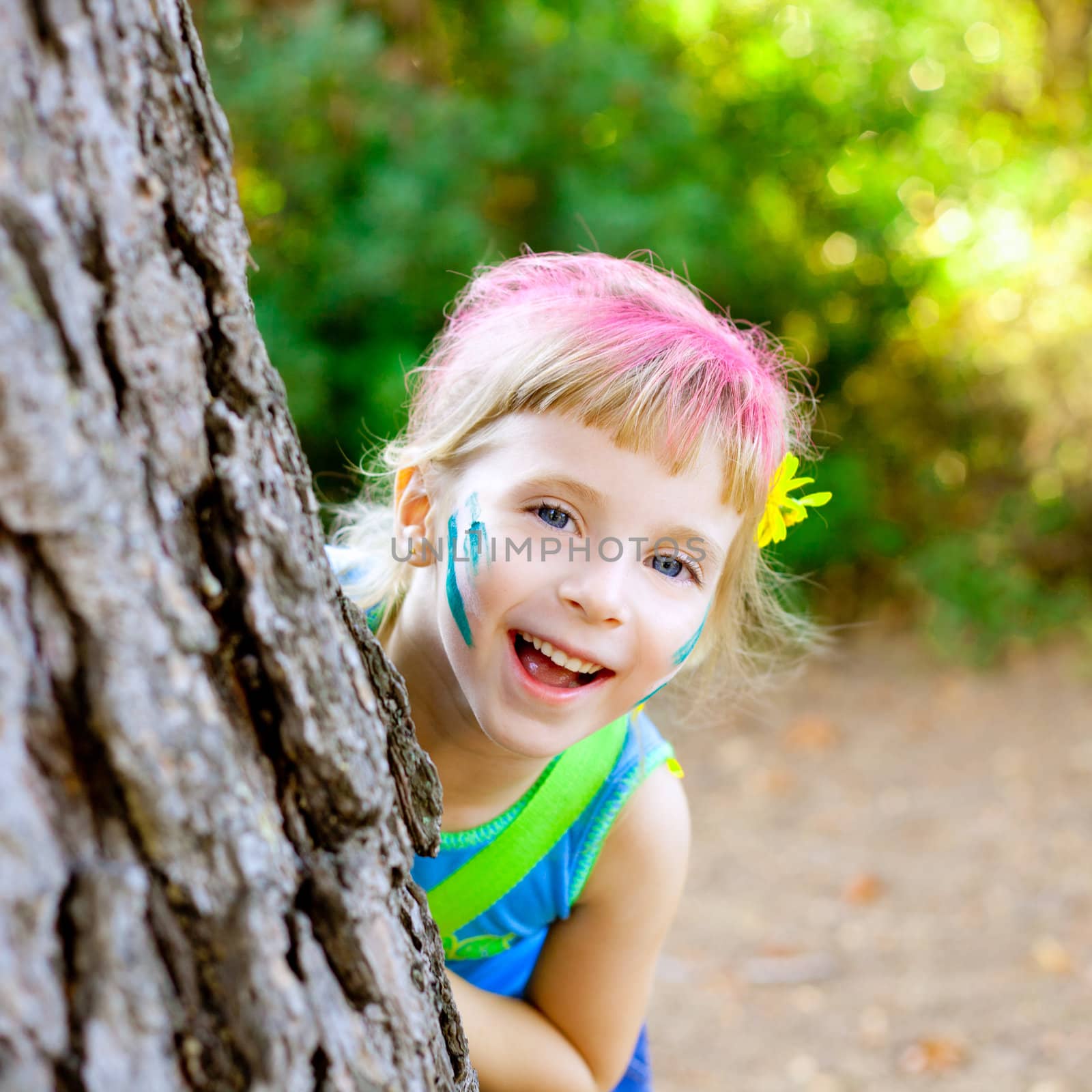 children little girl happy playing in forest tree with party makeup