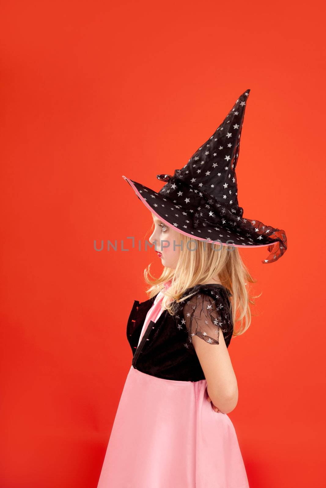 Halloween kid girl costume on orange background