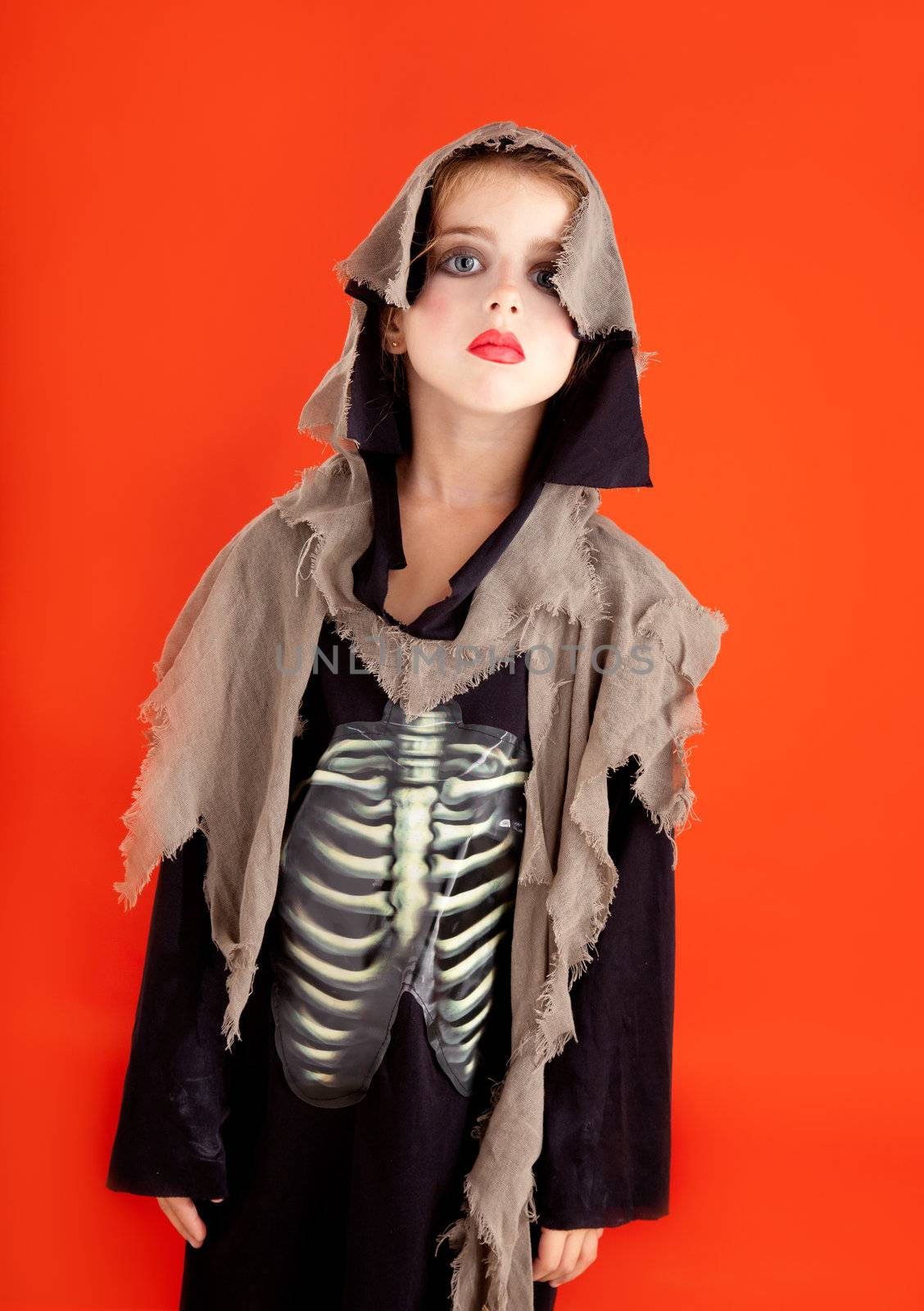 Halloween kid girl costume on orange by lunamarina