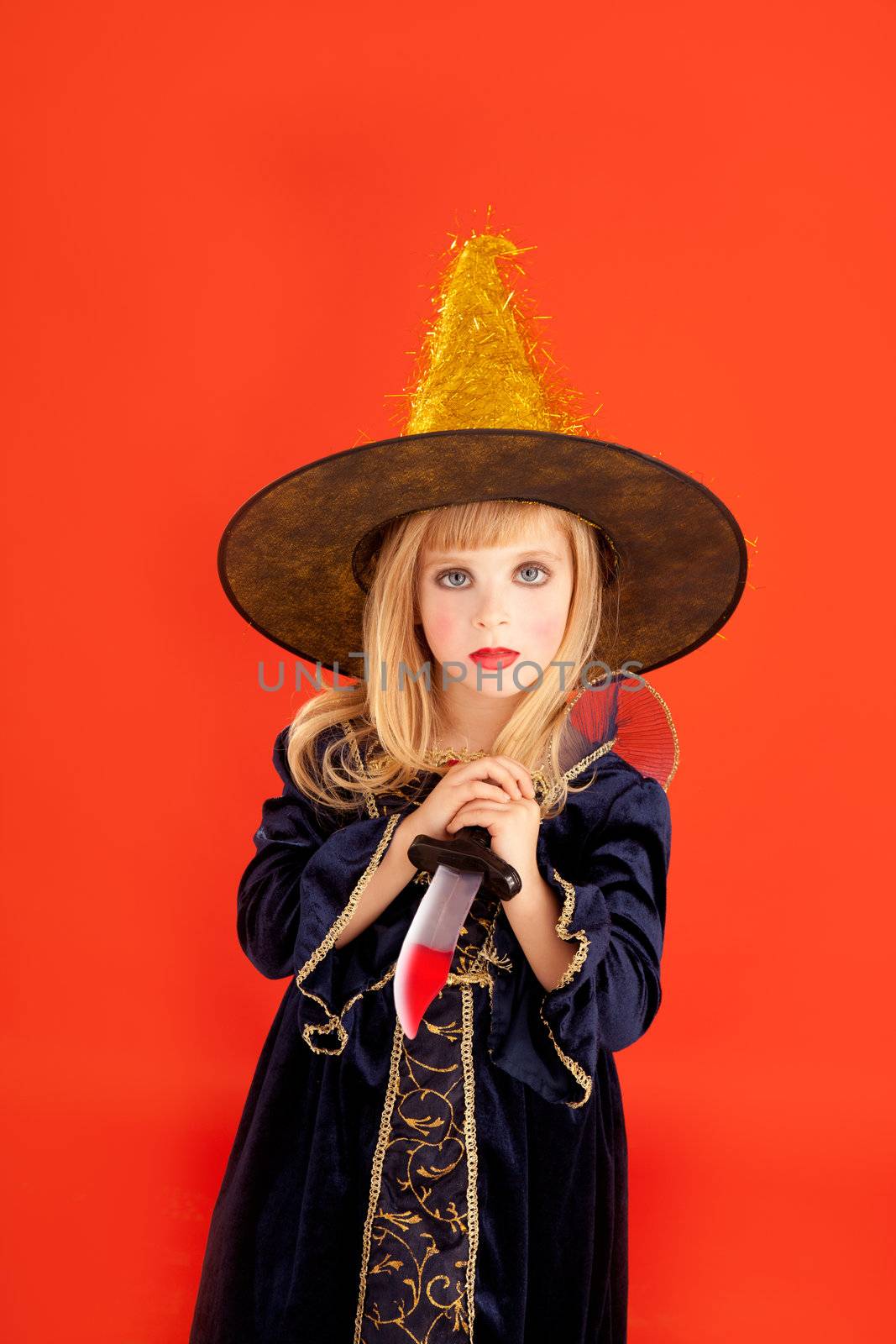 Halloween kid girl costume on orange background