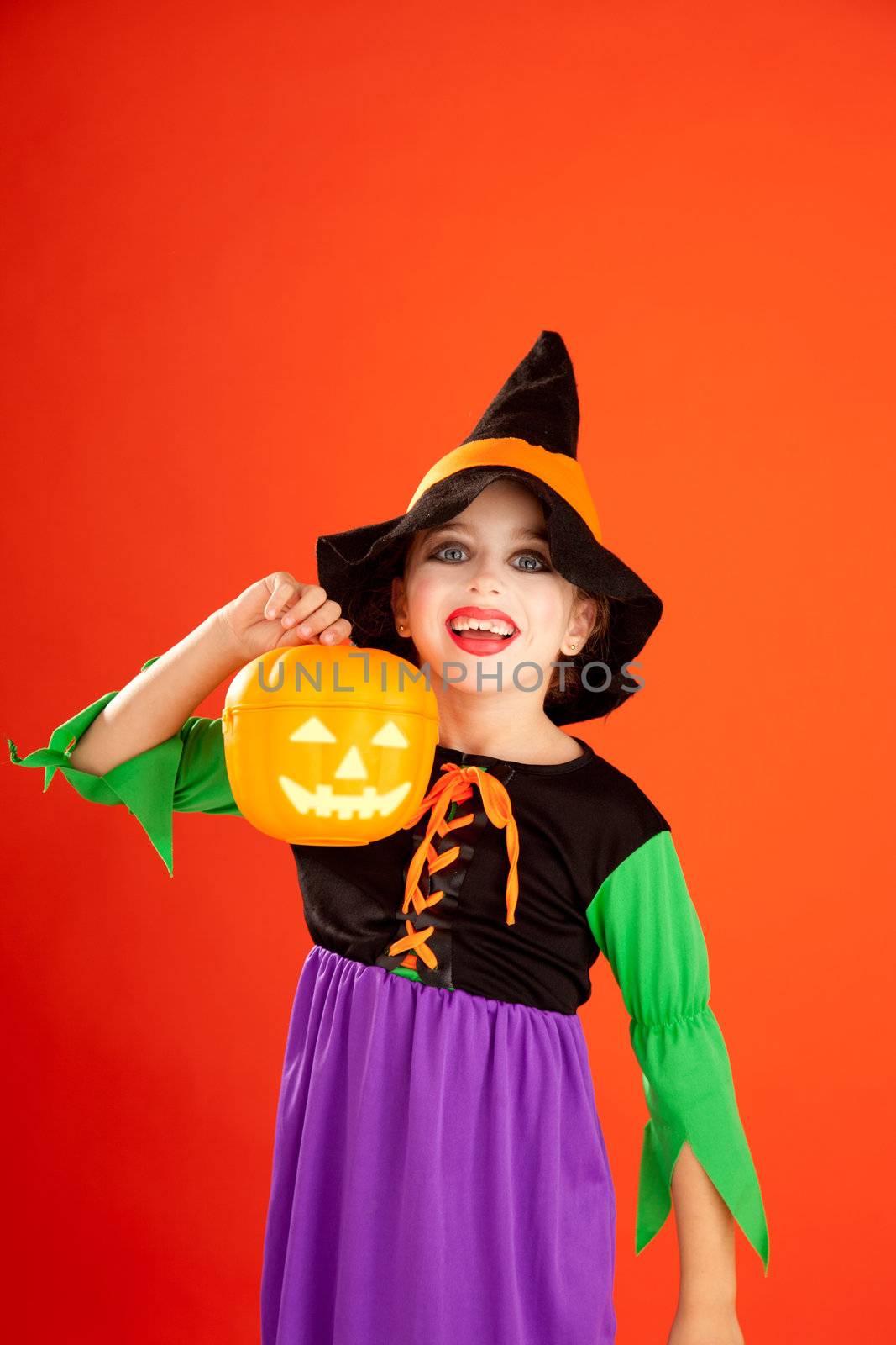 Halloween kid girl costume on orange by lunamarina