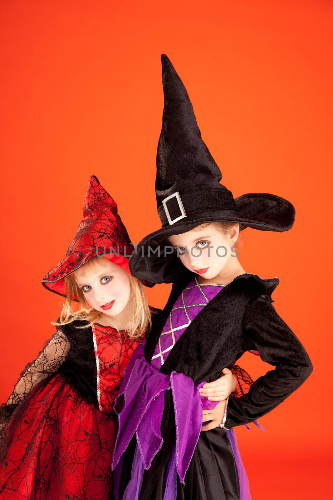 Halloween sister kid girls on orange background