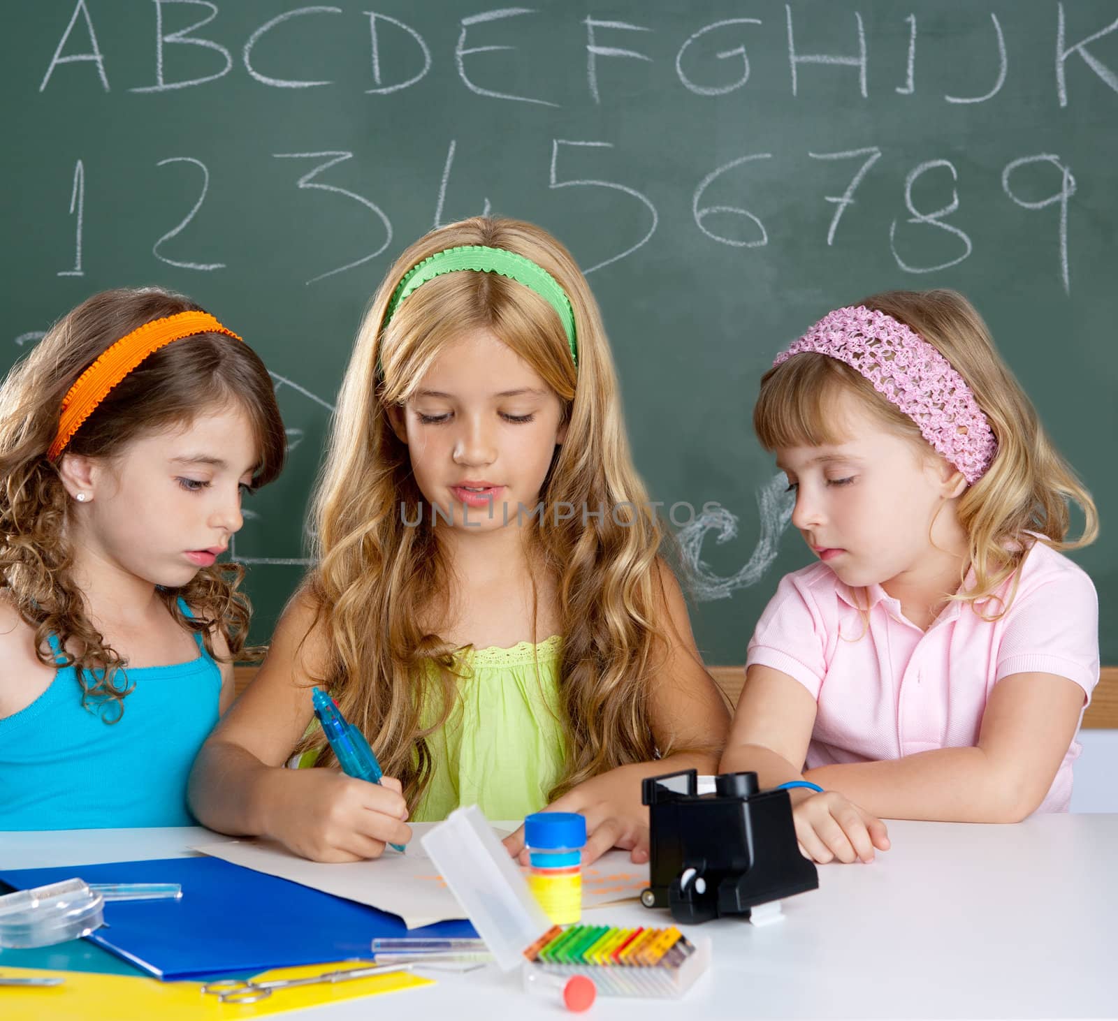 kids group of student girls at school classroom by lunamarina