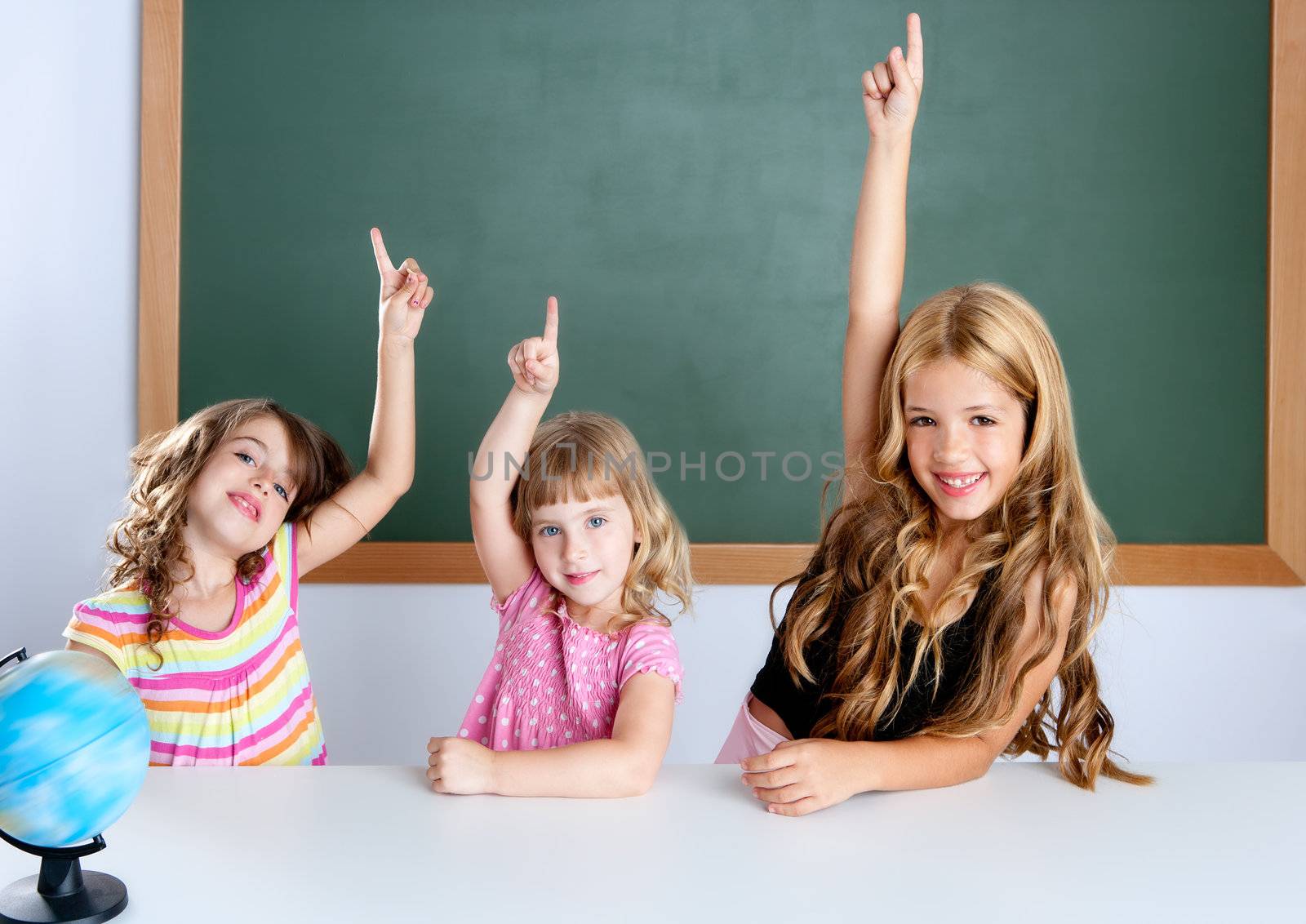 kids student clever girls in classroom raising hand by lunamarina