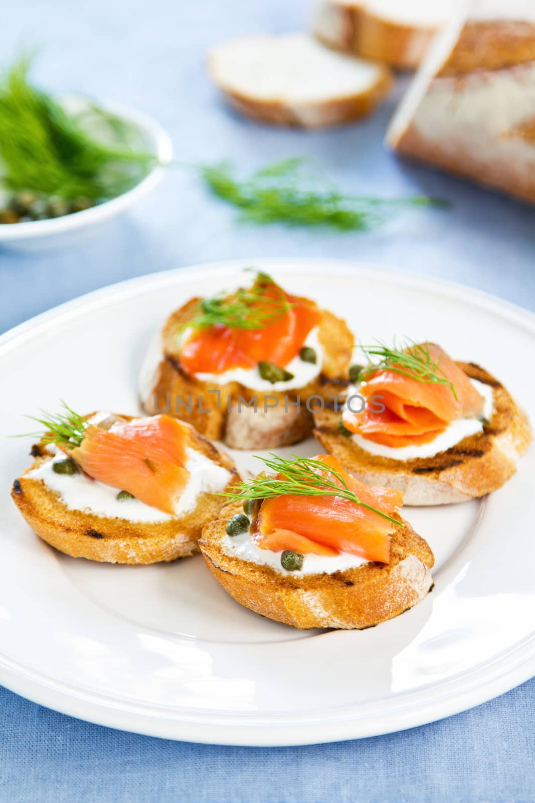 Smoked salmon crostini with cheese,caper and dill