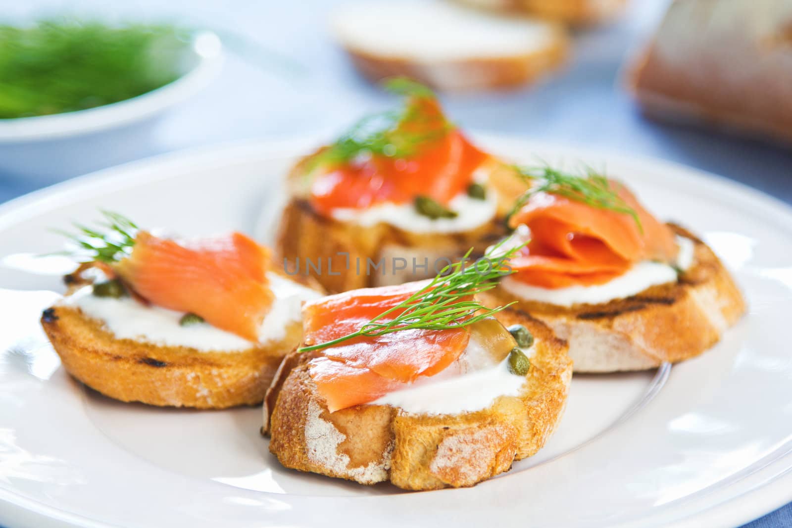 Smoked salmon crostini with cheese,caper and dill