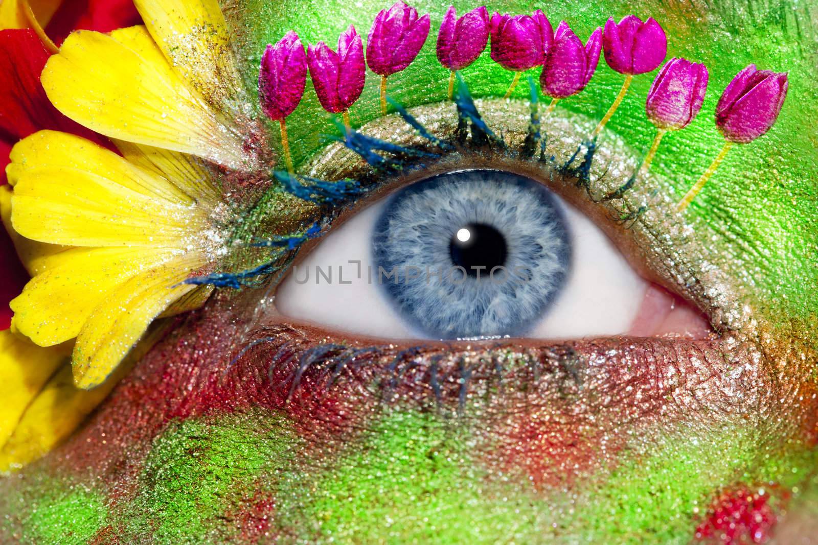 blue woman eye makeup inspired in spring with flowers meadow and yellow petals