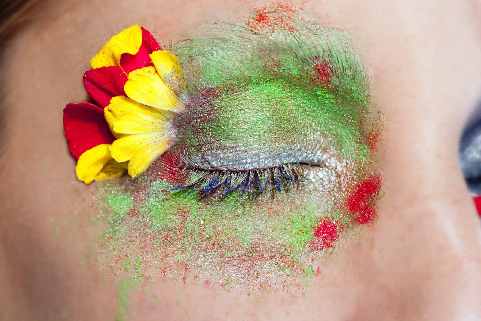 closed woman eye makeup inspired in spring with flowers meadow and yellow petals