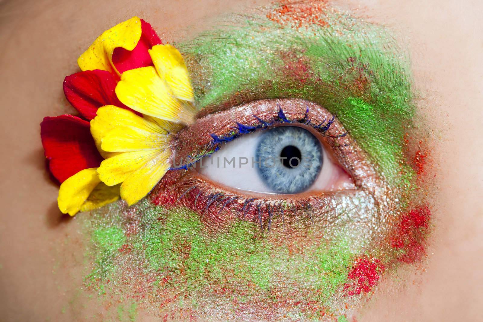 blue woman eye makeup inspired in spring with flowers meadow and yellow petals