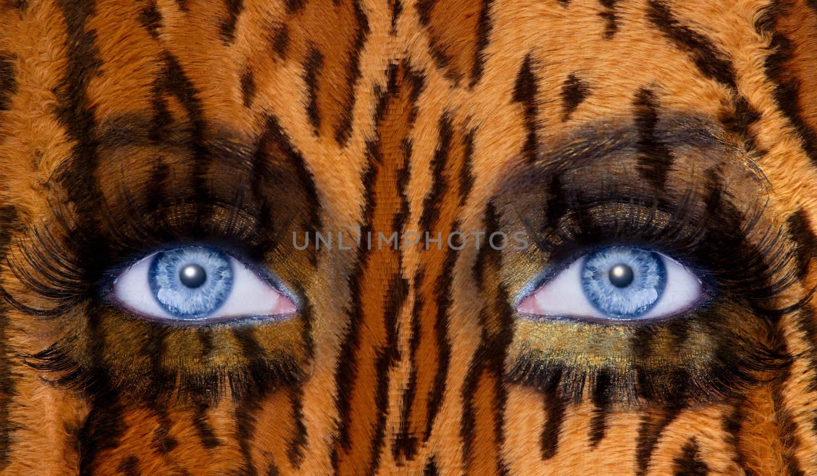 abstract blue woman eyes makeup with a leopard jaguar skin texture