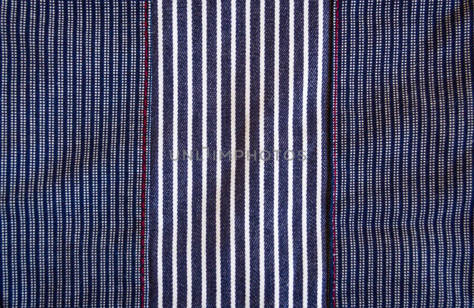 Fabric striped texture in dark blue, red and white tones