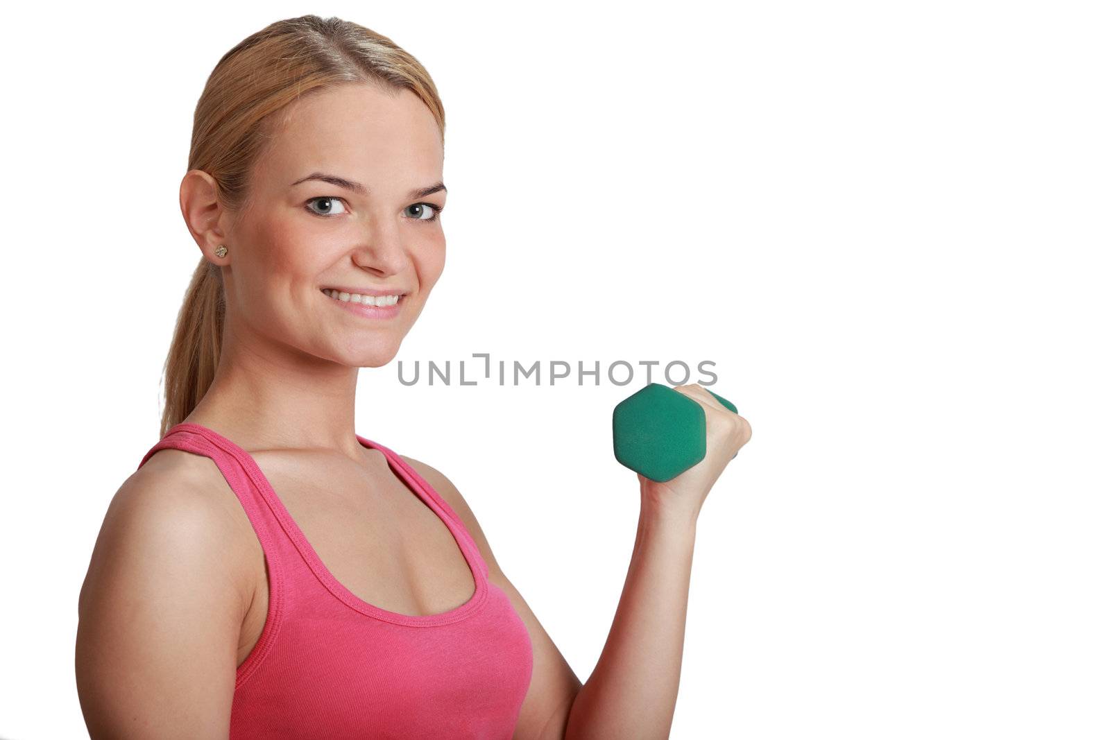 Portrait of a beautiful young blonde girl smiling and holding a green dumbbell isolated against a white background.