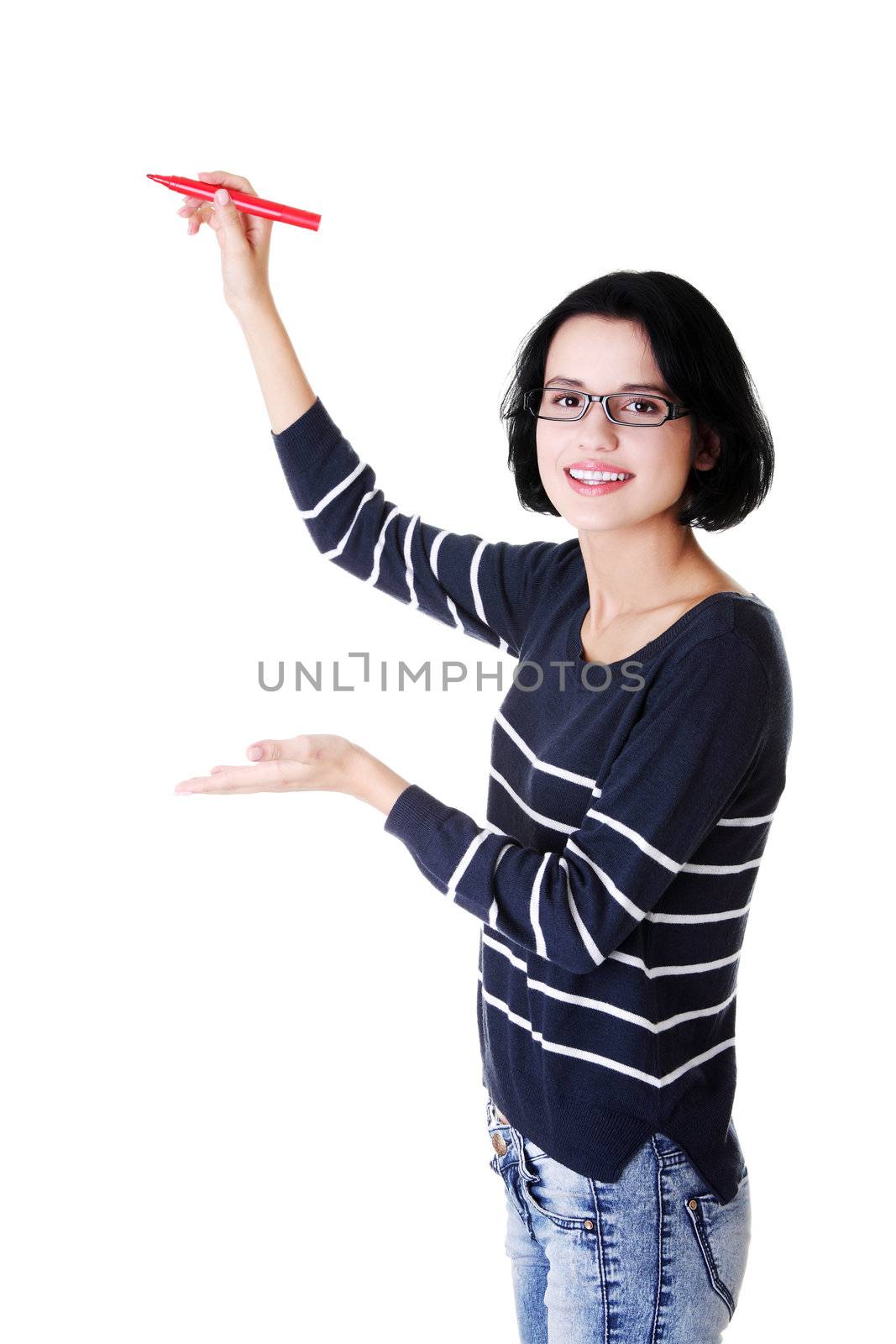 Young student woman writing something on abstract screen with red marker