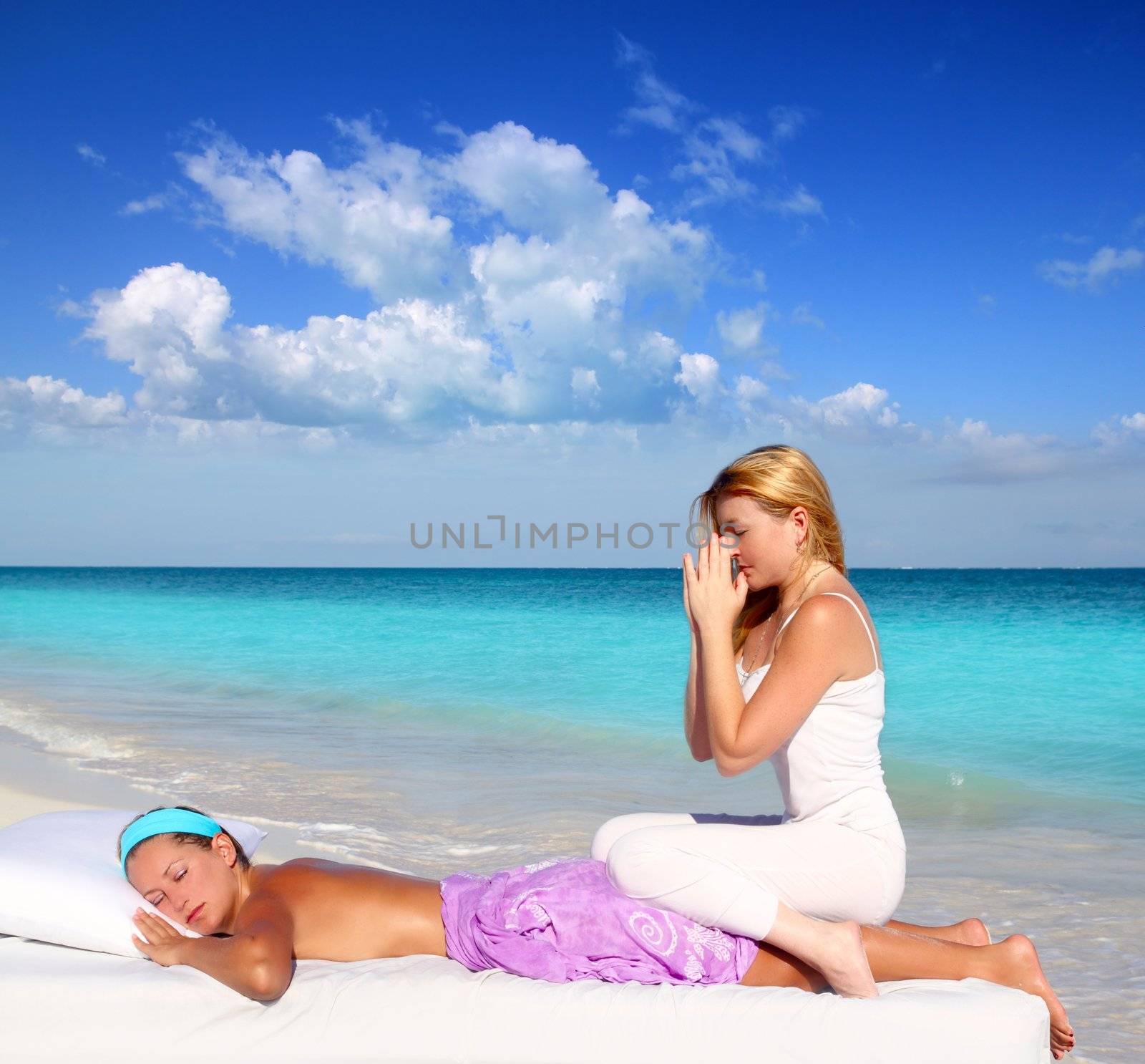 blond woman therapist in Caribbean beach doing meditation shiatsu massage in paradise
