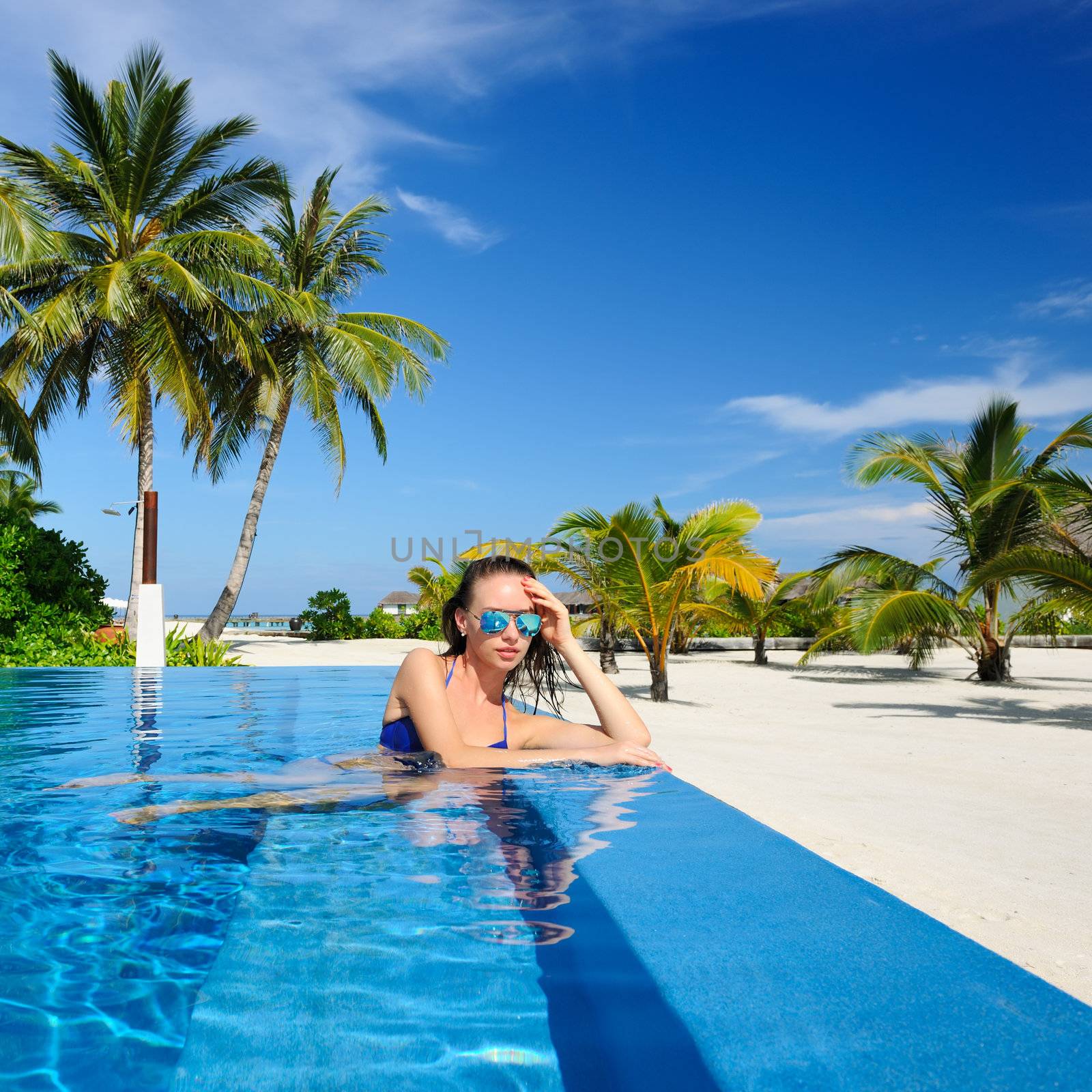 Woman at poolside by haveseen