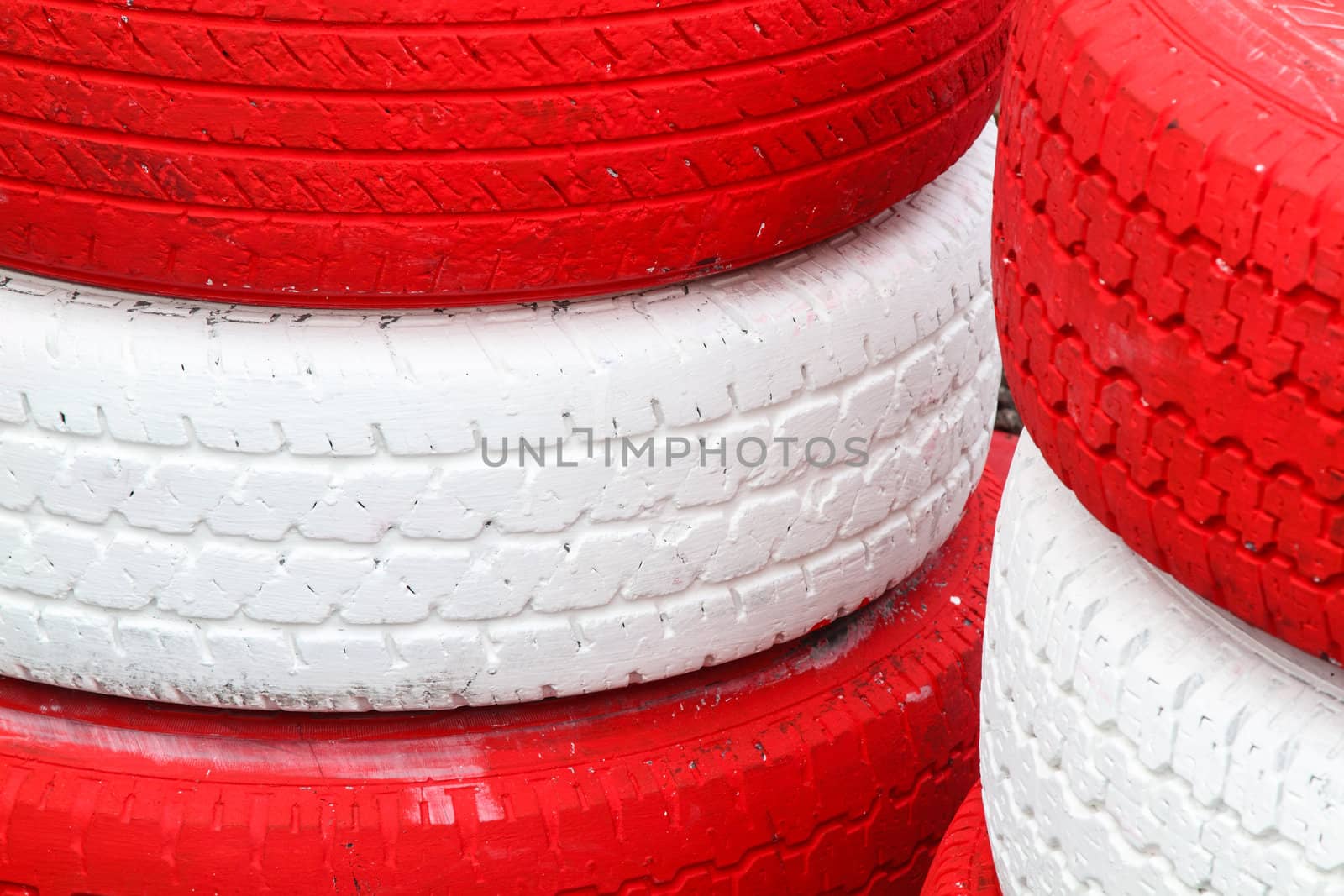 Pile red and white rubber tires for background