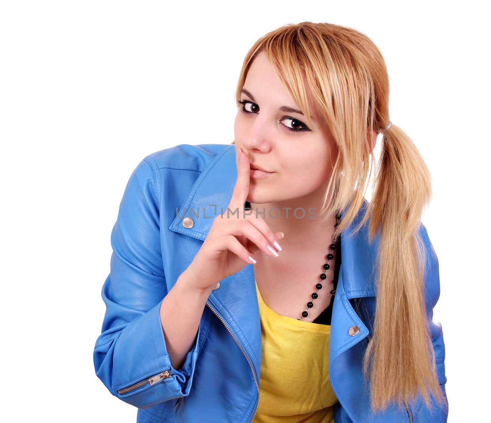 teenage girl making silence gesture on white 