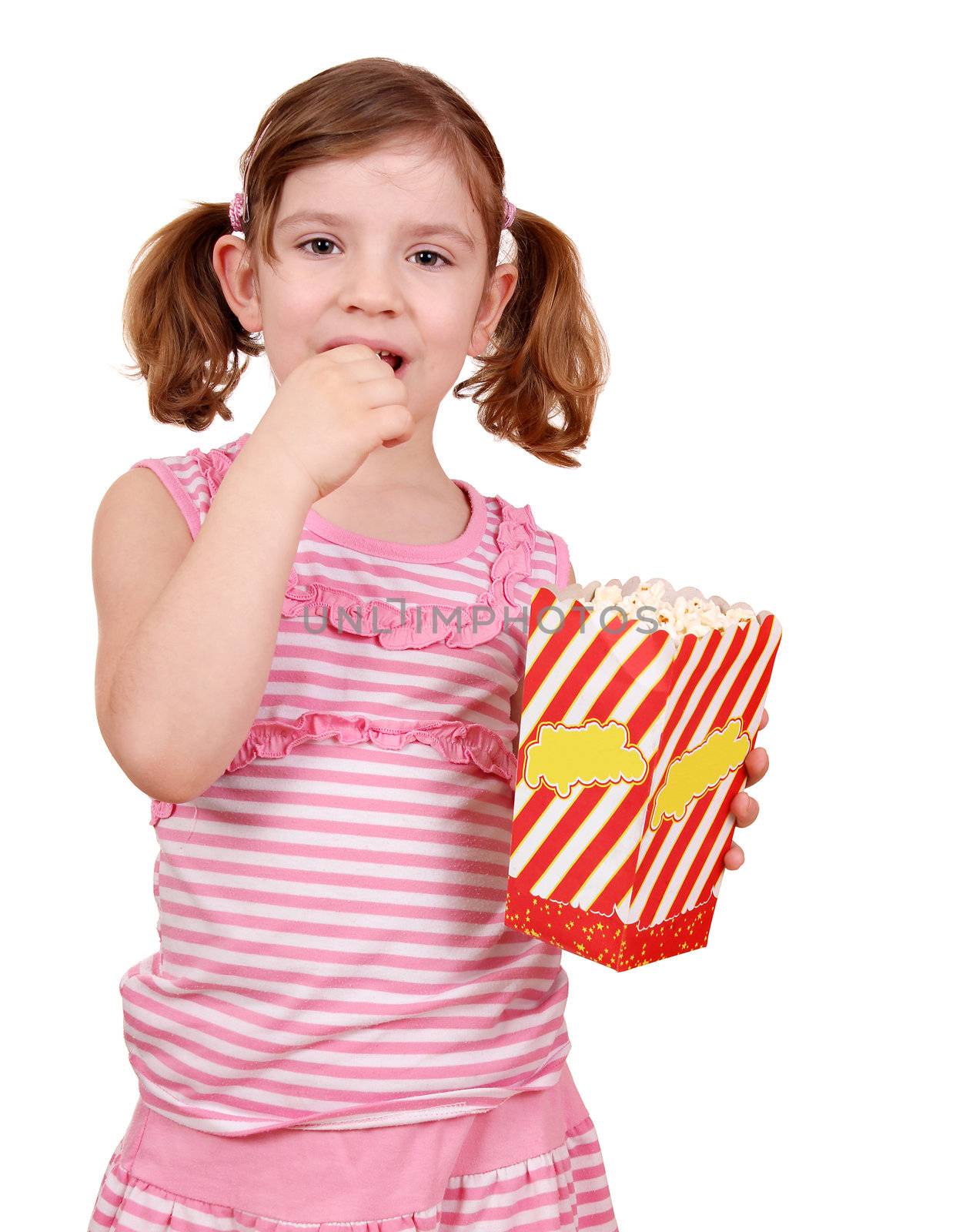 little girl eat popcorn on white by goce