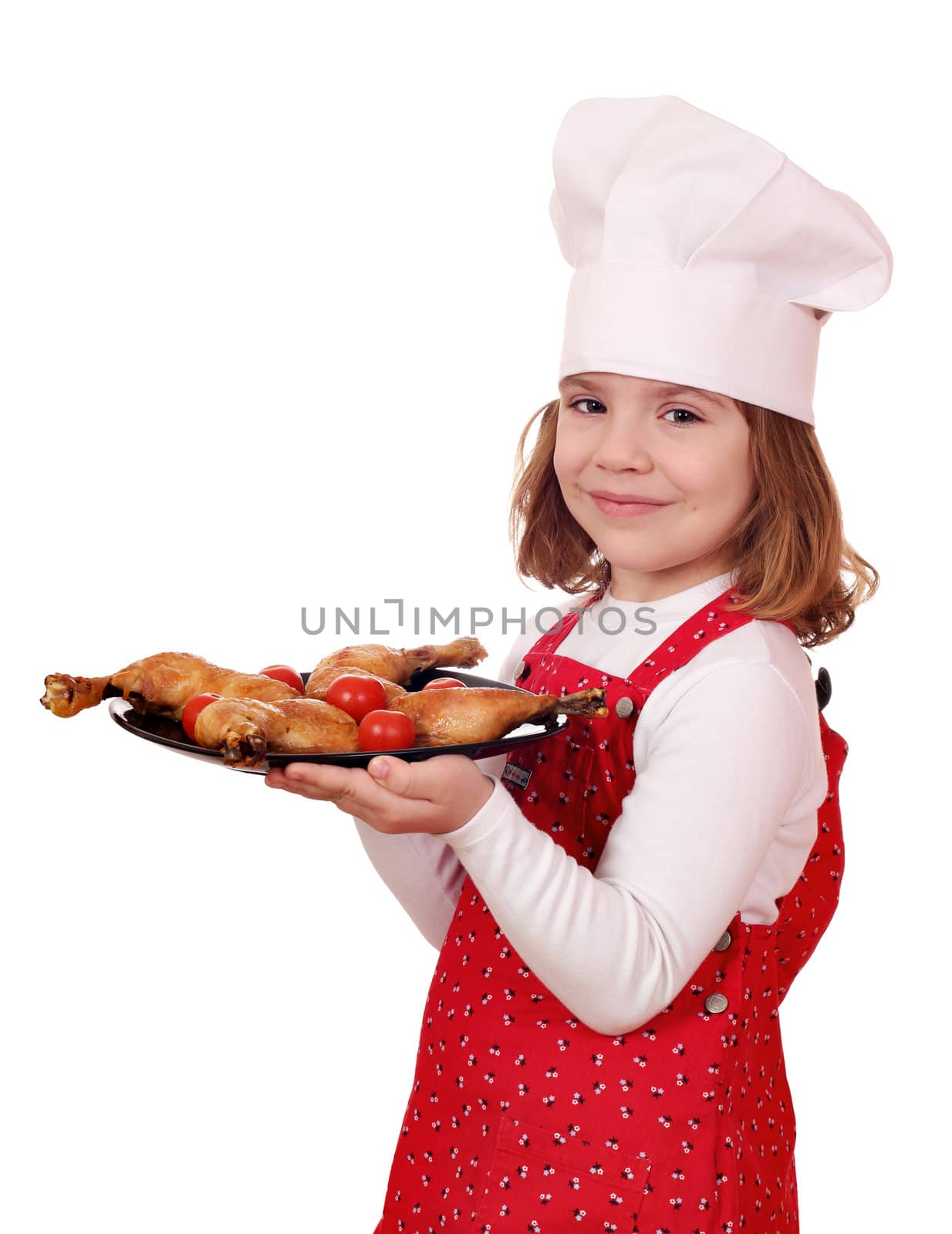 little girl cook hold dish with chicken drumsticks