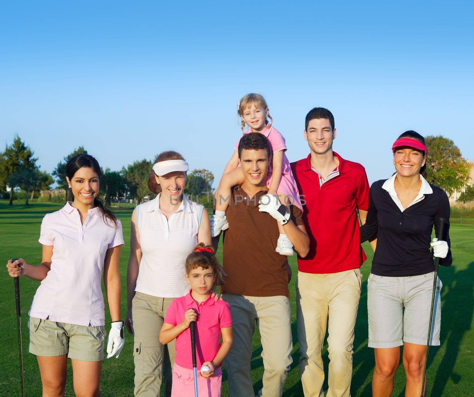 Golf course group of friends people with children by lunamarina