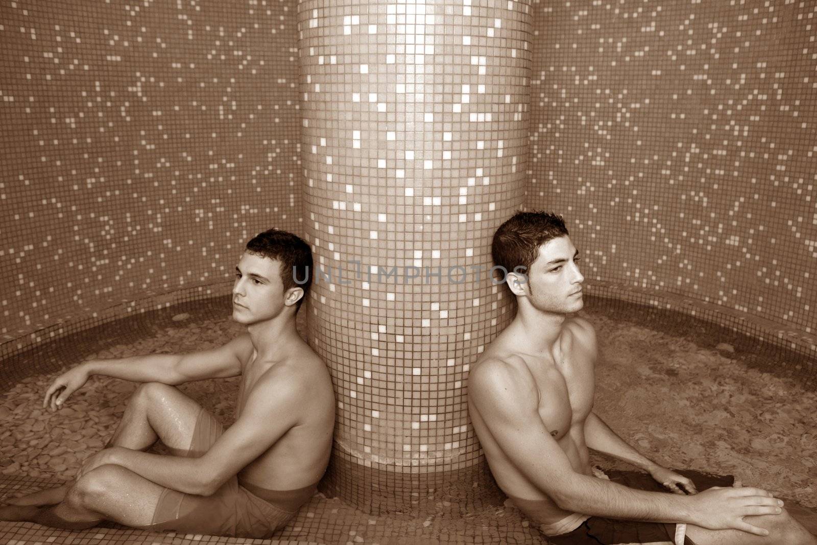two young spa men sitting pool cold water therapy after sauna