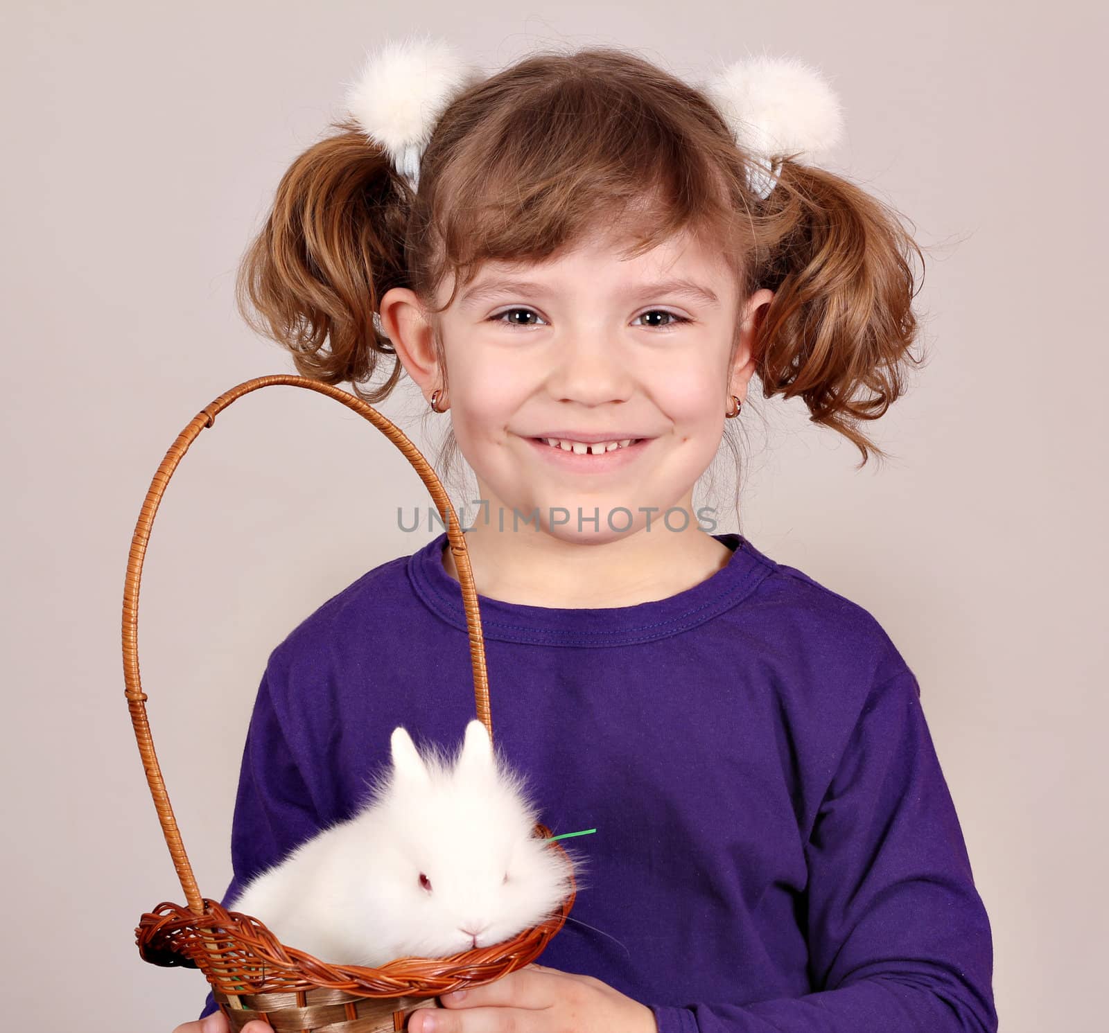 beautiful little girl and white dwarf bunny pet