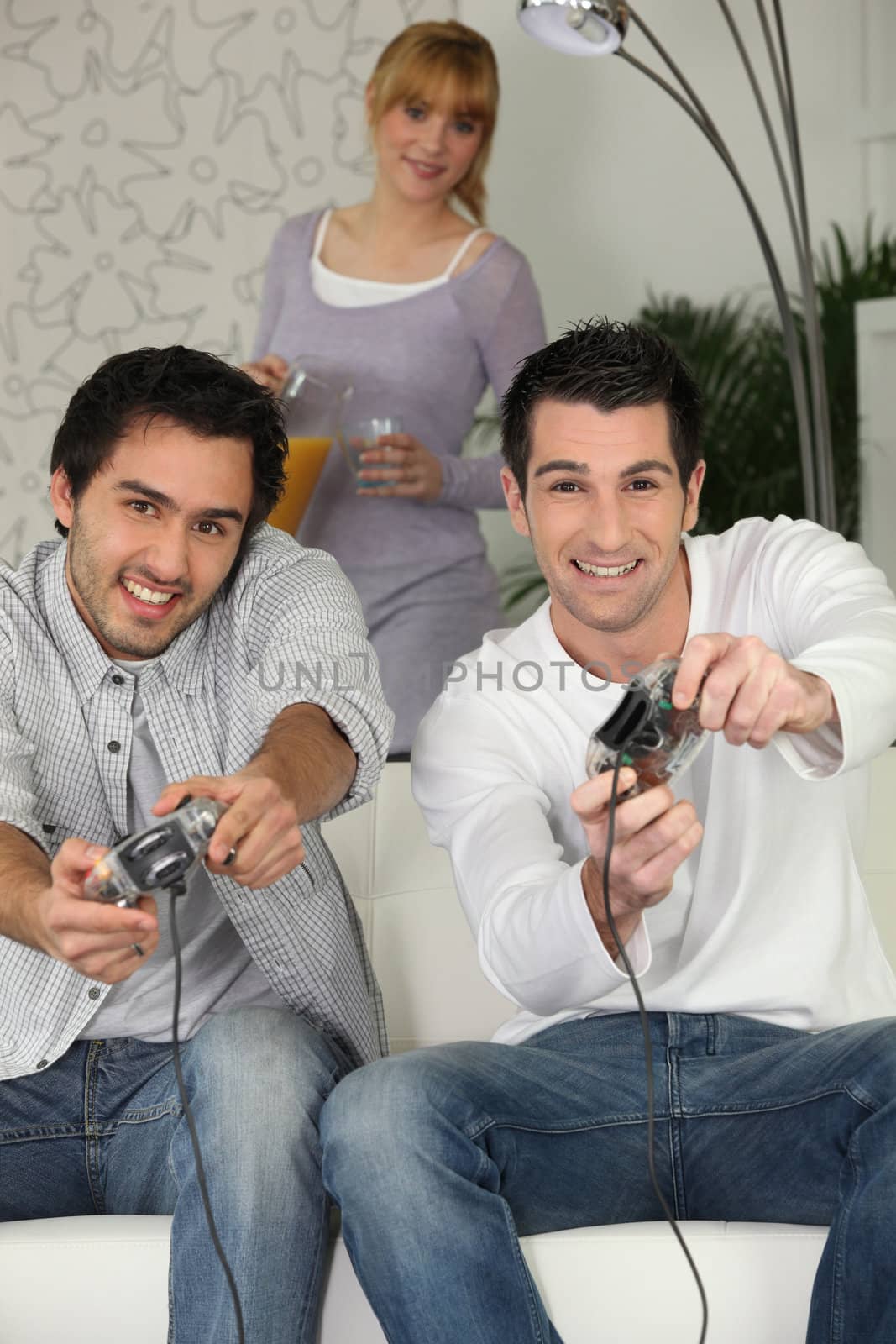 men playing video games by phovoir