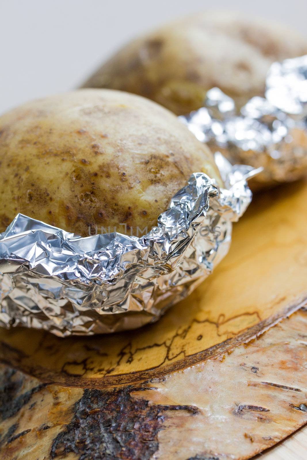 fresh baked potatoe with sour cream by Teka77