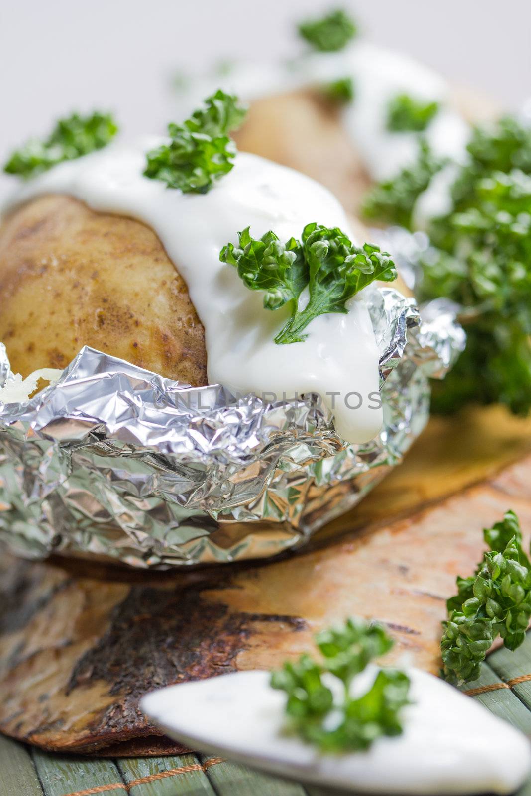 fresh baked potatoe with sour cream by Teka77