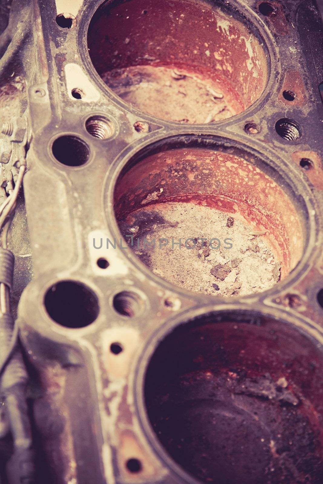 close up image of old automobile cylinder block by ponsulak