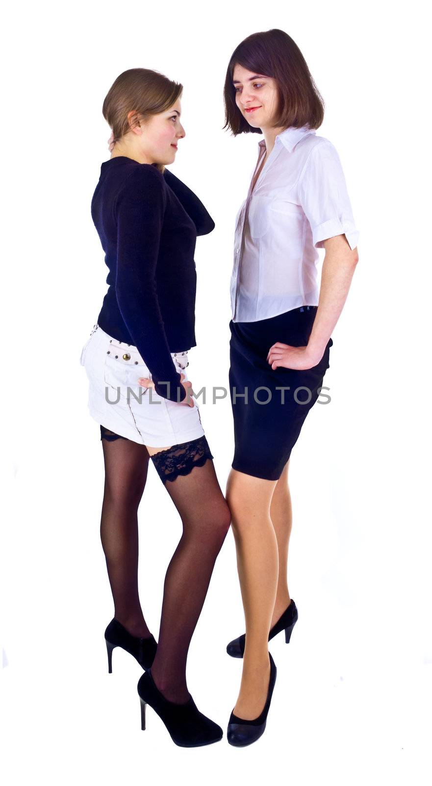 two young females standing isolated on the white